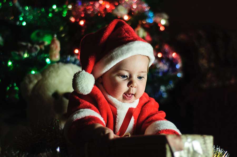 gifts for babies and new parents. baby with Christmas hat